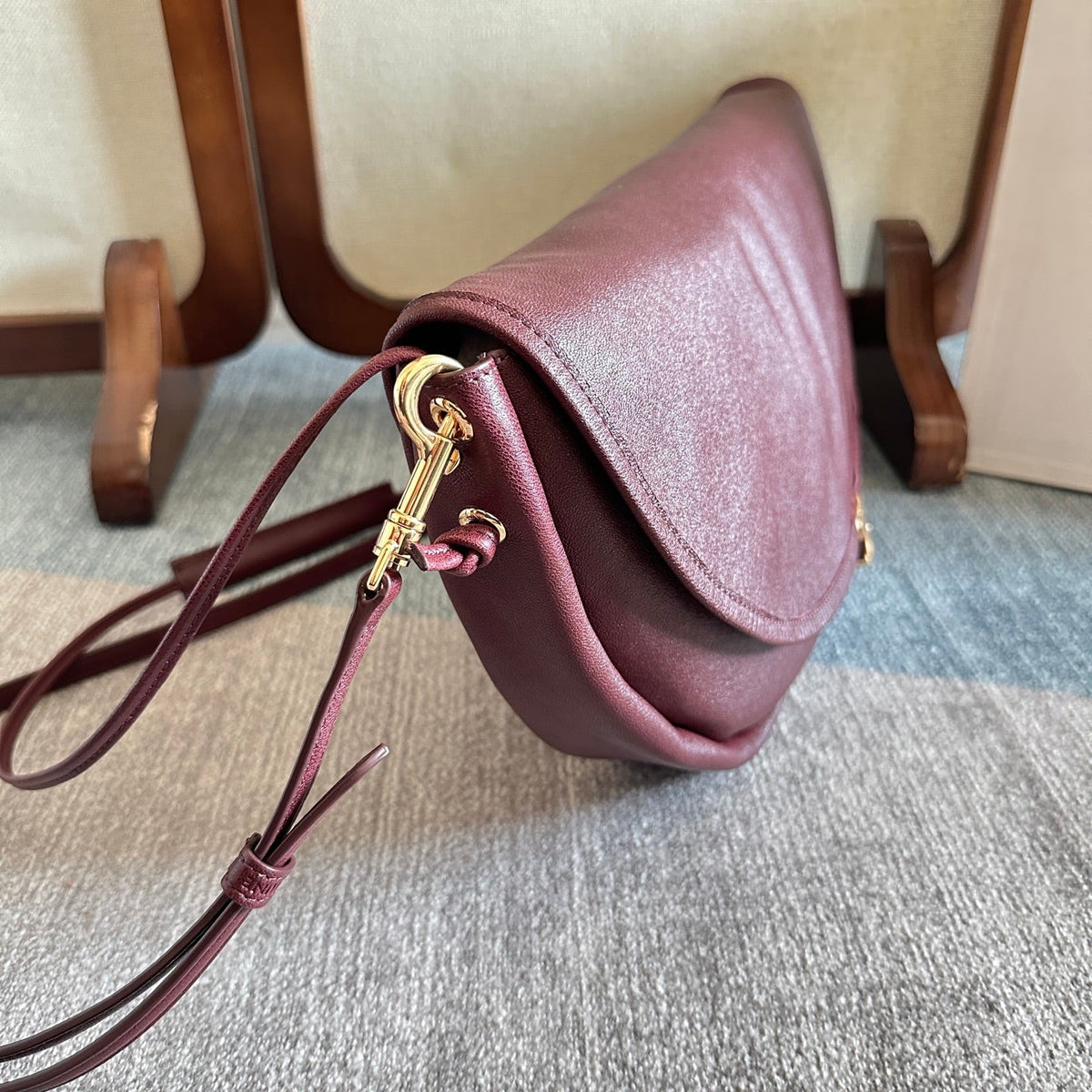 CELINE 25S HALFMOON SOFT TRIOMPHE BAG 46MM IN SYRAH RED SUPPLE SHINY LAMBSKIN