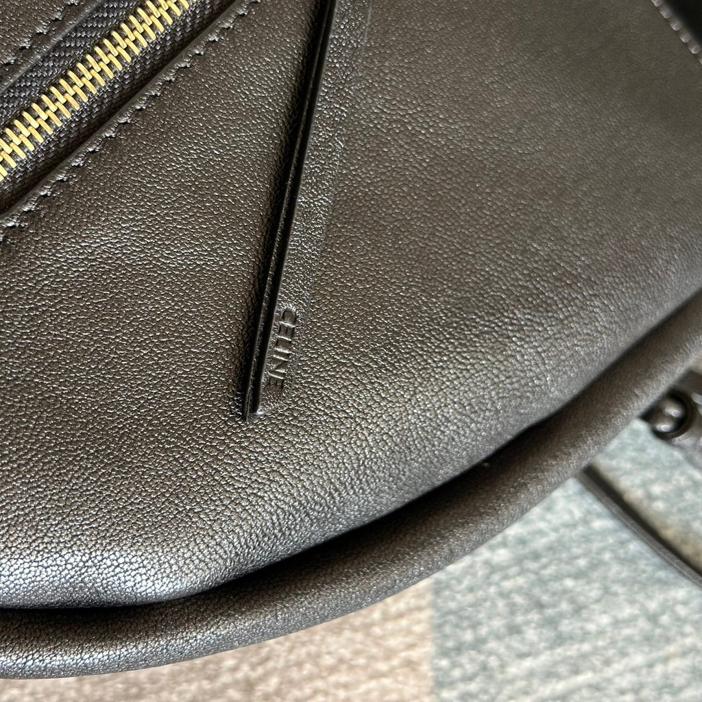 CELINE 25S HALFMOON SOFT TRIOMPHE BAG 46MM IN BLACK SUPPLE SHINY LAMBSKIN